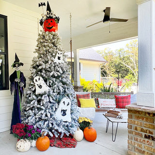 Halloween tree decorated with white ghost metal cutouts
