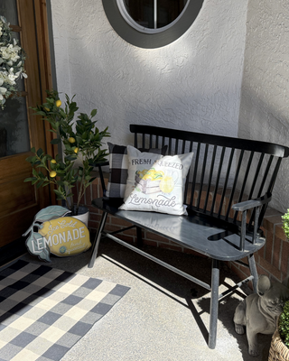Vintage lemonade sign next to black bench on farmhouse front porch wall art wall decor
