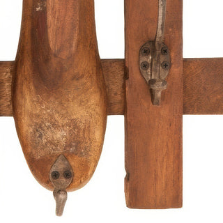 Close-up rustic wood wall hook rack detail