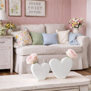White heart vases styled on cozy farmhouse living room