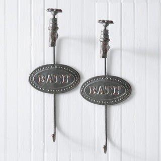 Pair of distressed cast iron bath hooks