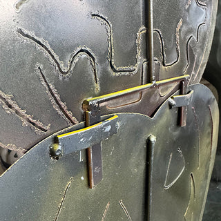 Backside view of stacked metal jack-o’-lantern Halloween decoration
