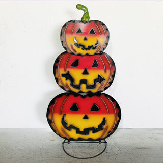 Full view of three-tier stacked metal jack-o’-lantern pumpkins with distressed finish for Halloween indoor or outdoor decor