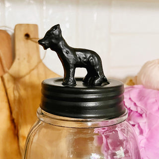 Black dog figurine lid on mason jar