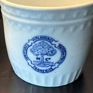 Vintage Belgian stoneware pot with blue tree logo on marble countertop beside apples and spoon of jam, farmhouse kitchen decor