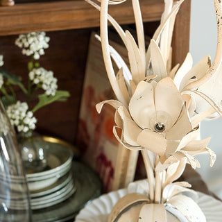 Decorative battery-powered tulip lamp with weathered metal finish and remote-controlled LED lighting