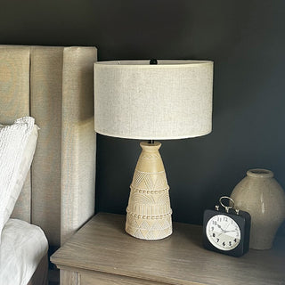 Ceramic bedside lamp styled on wooden nightstand