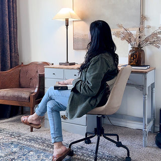 Bronze table lamp on rustic wood desk