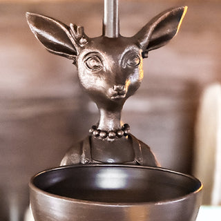 Close-up of bronze female deer lamp base with detailed facial features and beaded necklace design