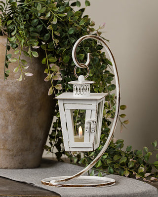 Vintage-Style Distressed White Hanging Lantern with Curved Metal Stand