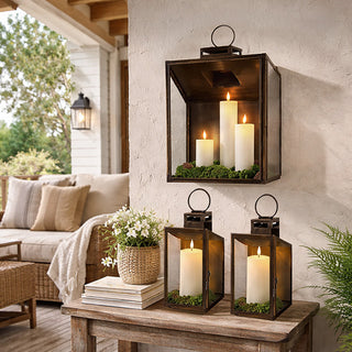 Rustic wall-mounted metal lanterns with candles