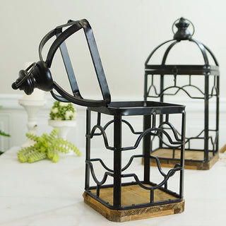 Detail of front door latch closure and geometric pattern metalwork on black and wood candle lantern