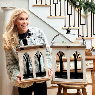 Farmhouse lantern decor shown with person holding