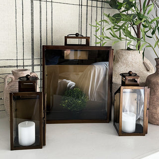 Trio of metal lanterns styled on shelf
