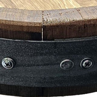 Detail of metal barrel band hardware and authentic whiskey barrel stave joinery on handcrafted lazy susan
