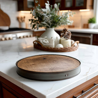 Whiskey barrel lazy susan displayed on modern farmhouse kitchen island with winter holiday decorations in background