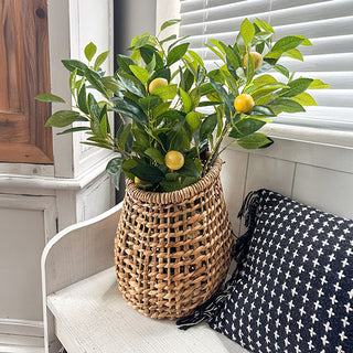 Faux lemon branch arrangement in woven basket