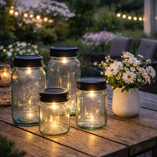 Solar powered mason jar lid lights creating ambient glow on outdoor patio table