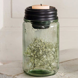 Mason jar candle holder with floral filler