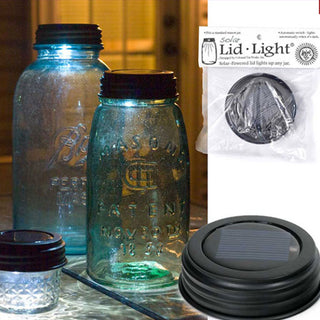 Solar lid lights illuminating vintage mason jars with automatic dusk sensor