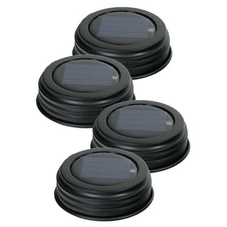 Four solar powered mason jar lids with built-in solar cells and LED lights