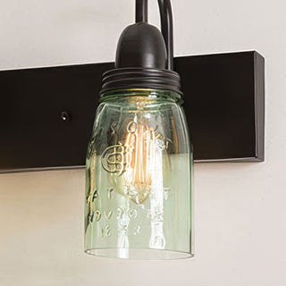 Single mason jar glass bathroom wall sconce close-up