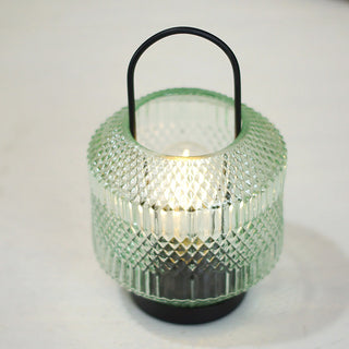 Battery operated LED glass lantern with warm glow close-up