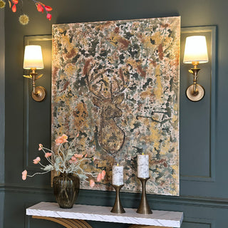 Botanical leaf wall sconces with LED lights and gold finish in elegant entryway setting