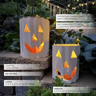 Set of two distressed metal jack-o’-lantern luminaries