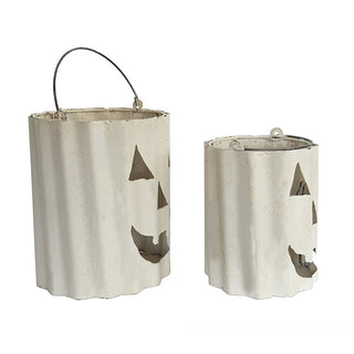 Set of two white distressed metal jack-o’-lantern luminaries