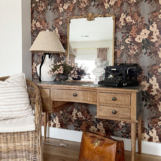 Vintage gold ornate mirror on rustic wooden desk