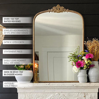 Antique gold arched mirror over fireplace mantel decor