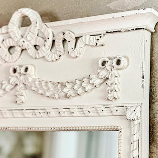Ornate distressed white mirror carved wood detail