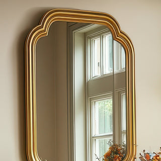 Close-up of elegant rectangular gold wall mirror