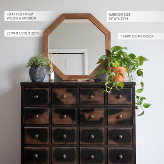 Octagon wooden mirror displayed on a dark dresser with houseplants and product dimension callouts for home décor shopping