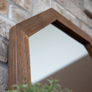 Close-up corner view of the octagon wood mirror frame highlighting craftsmanship and finish.