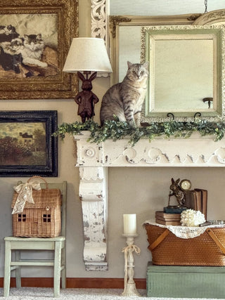 Chippy Wooden Mantel with bunny lamp and vintage artwork