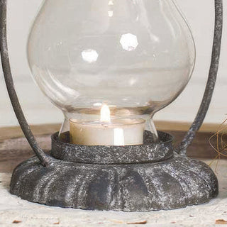 Glass candle holder base with lit tealight