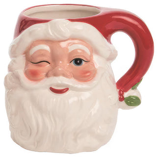Close up of winking Santa mug showing detailed hand painted facial features rosy cheeks and red hat with green holly