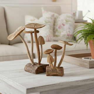 Hand-carved teakwood mushroom cluster sculptures on farmhouse coffee table with natural wood finish home decor