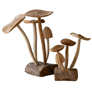 Two hand-carved teakwood mushroom cluster sculptures showing natural finish and bark edge base