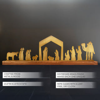 Distressed brass metal nativity silhouette on wood base against dark background, Christmas tabletop décor with product details