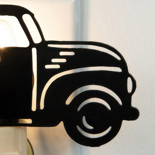 Close-up of black metal vintage truck night light detail