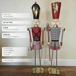 Two metal nutcracker decorations shown with product details, featuring distressed finish, gold accents, and measurements for large and medium sizes.