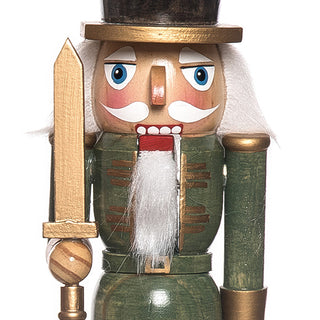 Detailed view of red soldier nutcracker king with gold crown ornate scepter and blue uniform accents