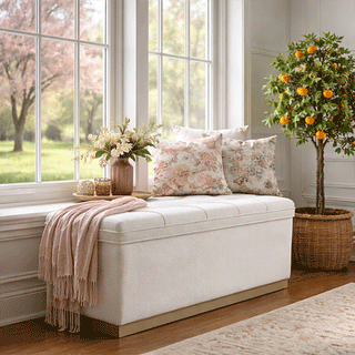 Cream upholstered storage ottoman bench with pillows