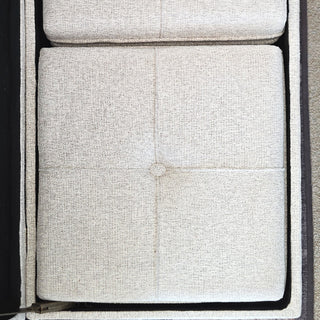 Button-tufted cushion top detail on cream boucle storage ottoman showing plush padded surface