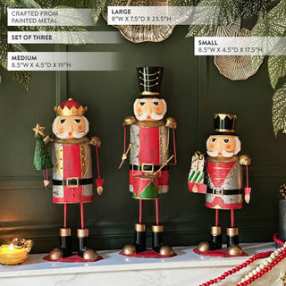 Nutcracker holiday figurine set of three in small, medium, and large sizes with painted metal design, perfect for festive mantel or entryway décor