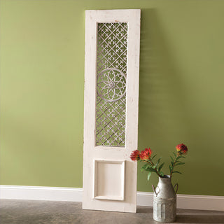 Tall decorative wood panel with ornate metal work and distressed white finish shown against sage green wall