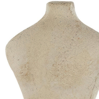 Close-up of textured paper mache shoulder and neck detail
